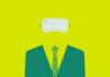 Person wearing a suit and tie and a headset.